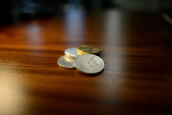 Photo A Stablecoin Peg is a mechanism that maintains the value of a stablecoin at a fixed rate, usually tied to a fiat currency like the US dollar